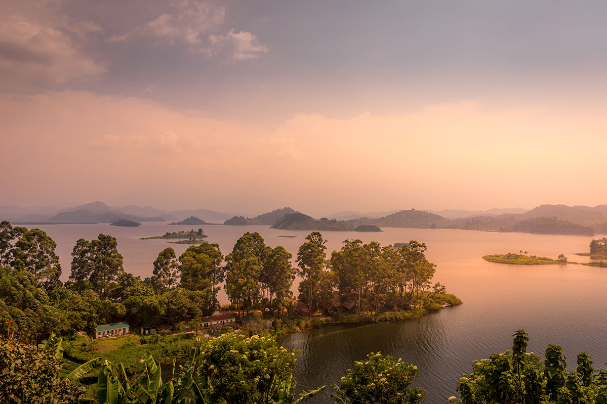 lake-mutanda-at-sunset-with-view-on-the-volcanoes-mount-muhavuru-and-mount-gahinga-in-east-africa-along-the-border-of-rwanda-and-uganda-AdobeStock_384322514 Lake Mutanda at sunset is the perfect setting to tune into your blue mind
