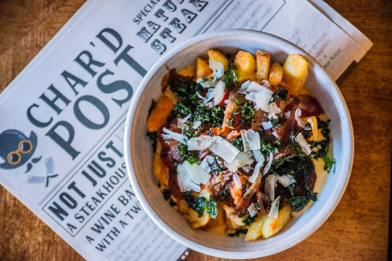 Cheese sauce loaded fries at Char'd